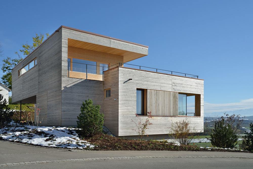 Layered Wood Boxes: Weinfelden House by k_m architektur