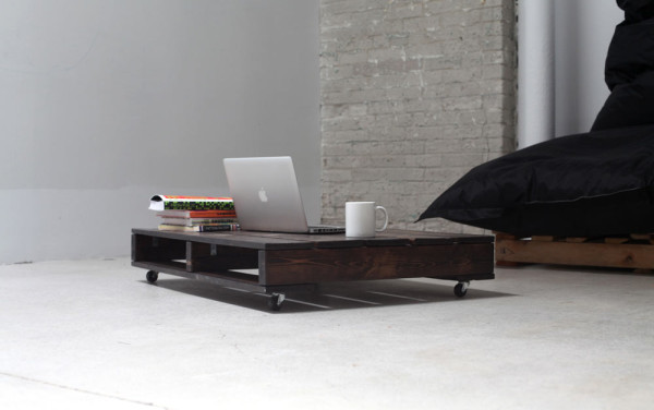 Table on castors, handcrafted from reclaimed wood by an employee