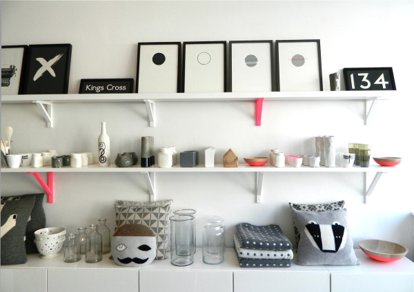 The four circle prints on the top shelf are by Hannah Jordan.