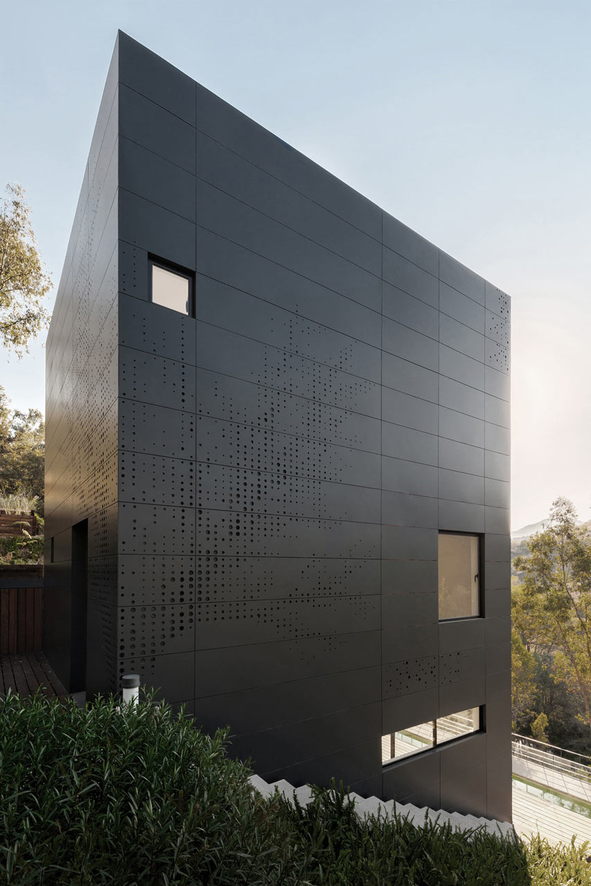 A Stacked Module House with a Perforated Facade