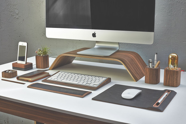 The Monitor Stand raises screens 4" from the desk surface for a more ergonomic viewing angle reducing neck strain. Additionally, the space underneath is designed to provide additional storage space.