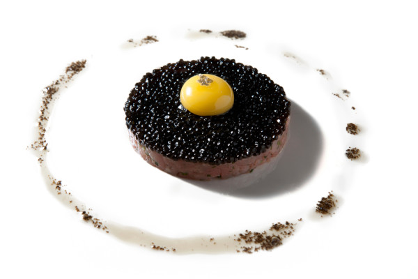 Veal tartare, quail egg, toasted brioche, and truffle ‘caviar’ by chef Mark Pensa