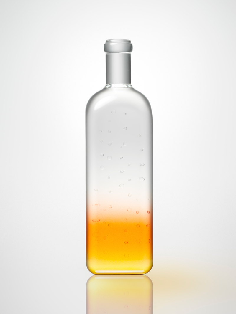 nendo creates glass bottle capturing the ripples of natural spring