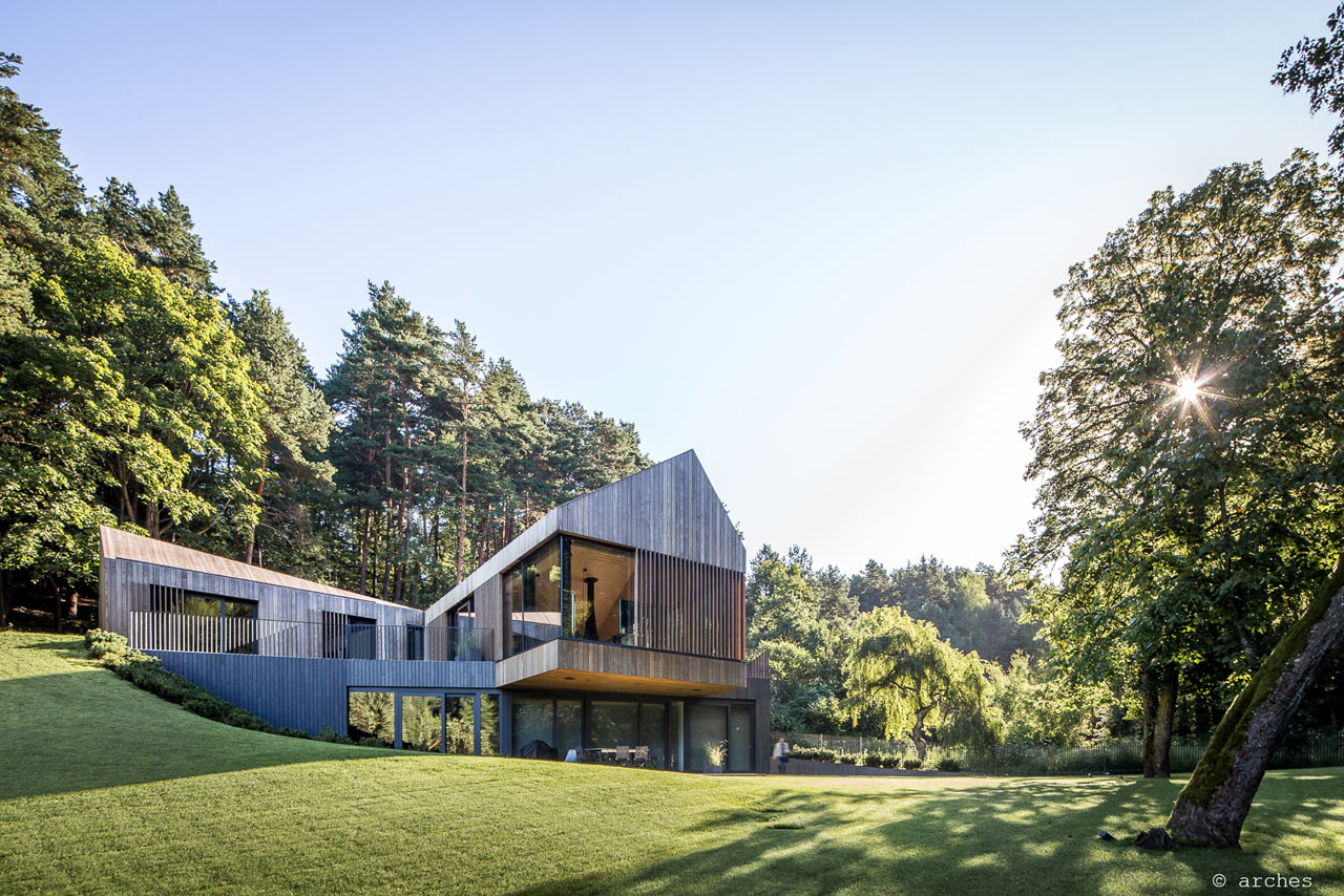 A Pine-Clad Villa Built into a Slope in Lithuania