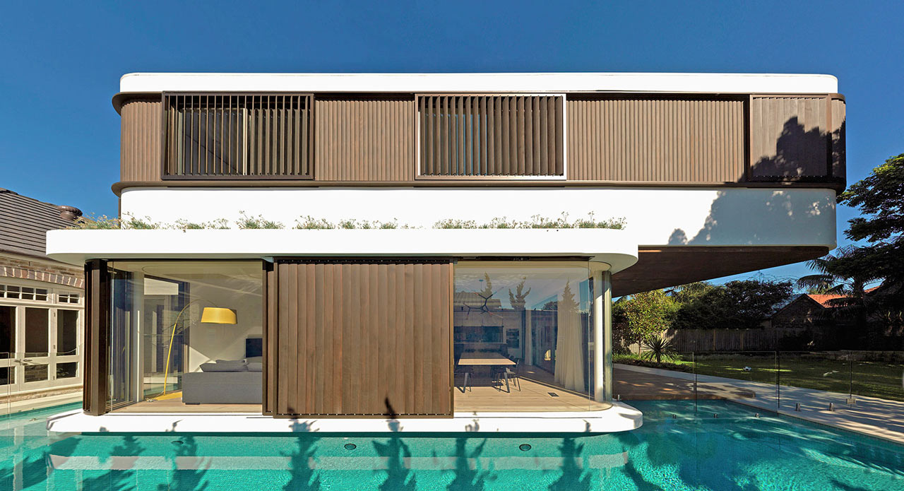 A Modern  House  with a Wraparound Swimming  Pool  Design  Milk