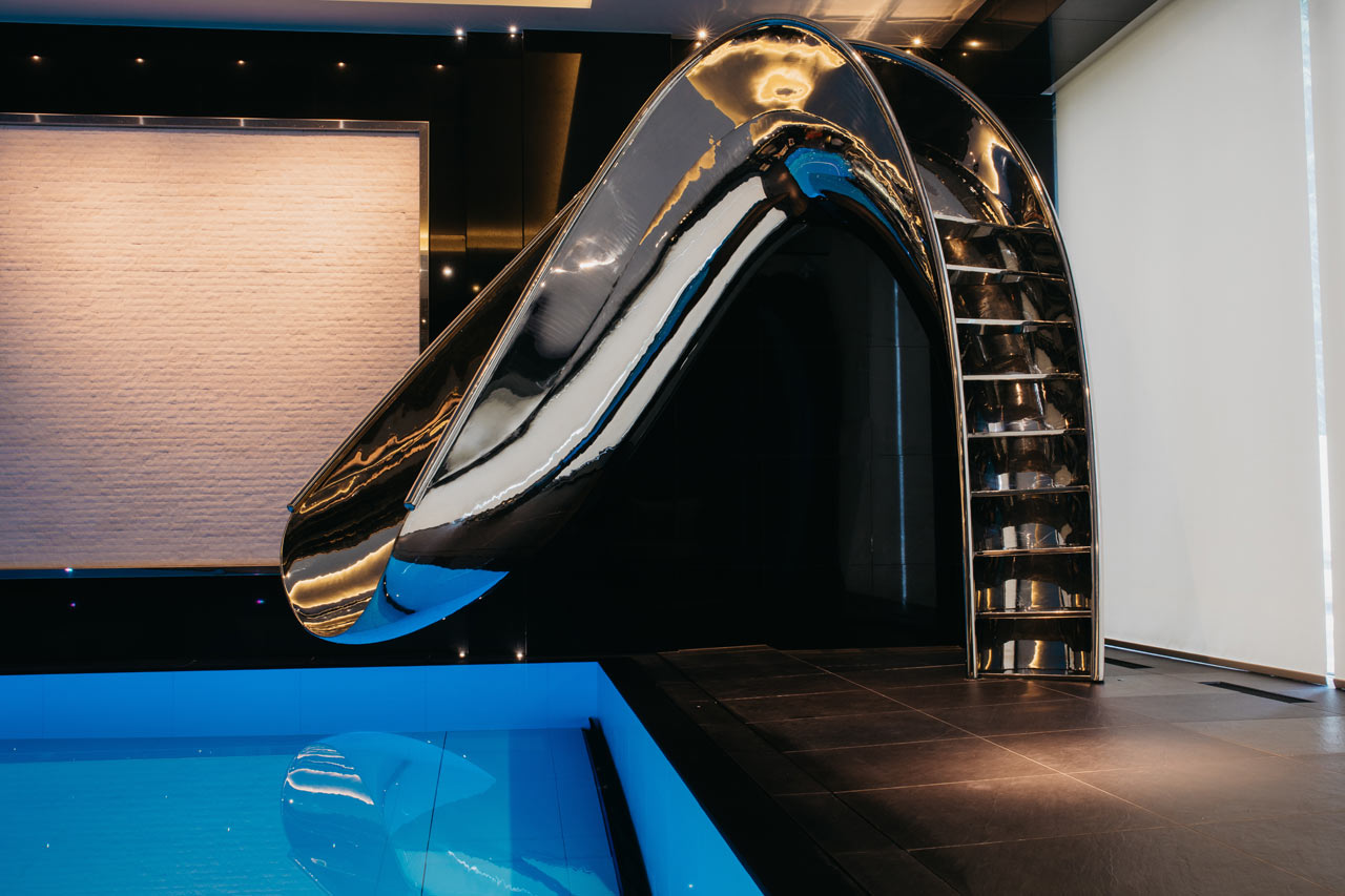 Sleek Sculptural Water Slides For The Modern Pool
