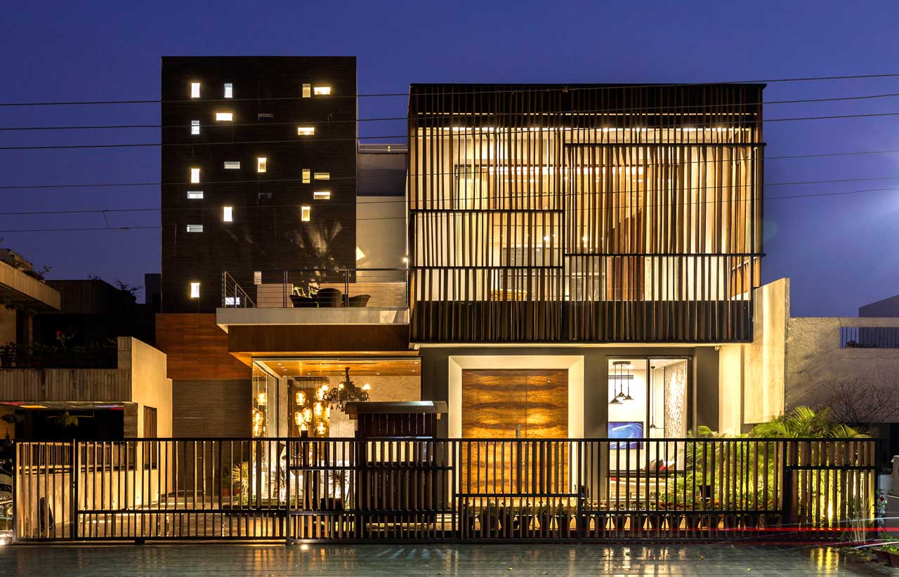 A House in Panchkula with Glass Walls and an Elevated Pool