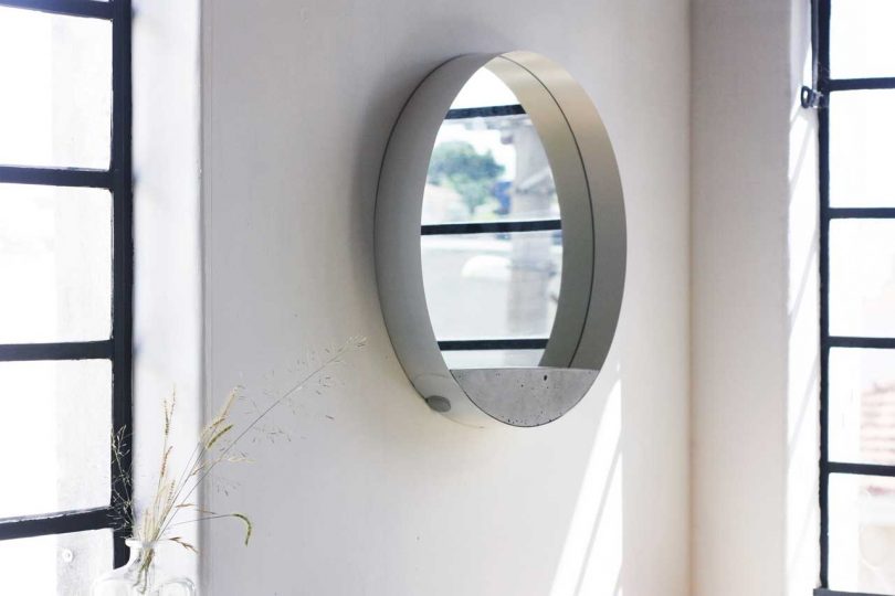 A Wall Mirror Composed of Three Materials and an Unusual Structure by Estúdio Parrado