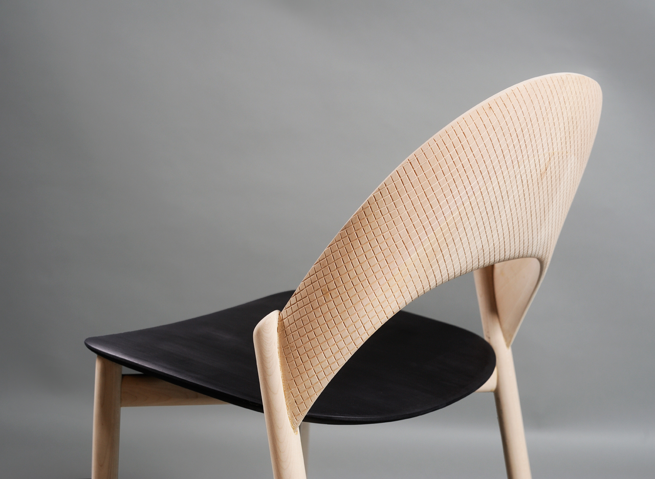 The Solid Wood Sana Dining Chair Will Hug You While You Sit