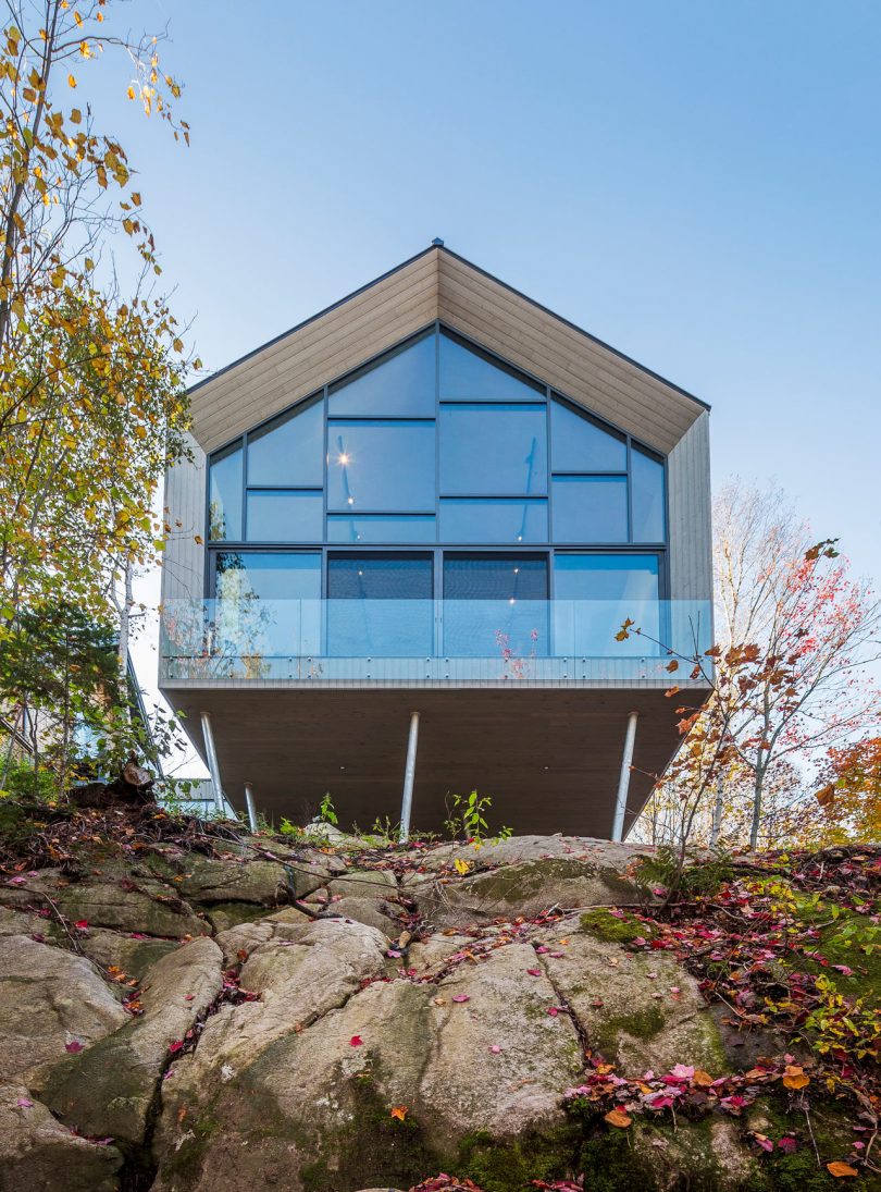 This Workshop on a Cliff Is a Modern Addition to a House Overlooking a Lake