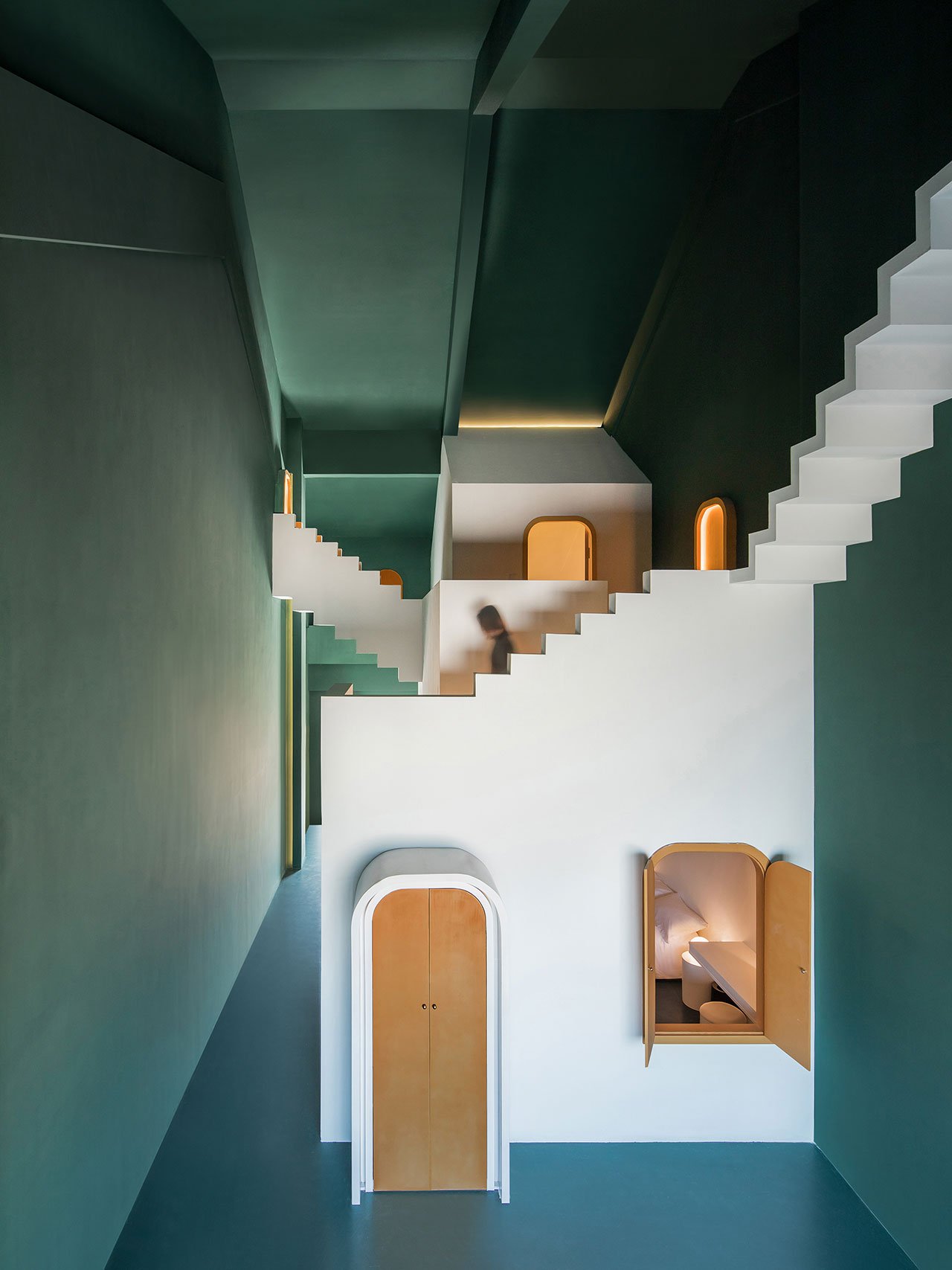 These Surreal Guesthouses with Impossible Staircases Have Alice in Wonderland Vibes