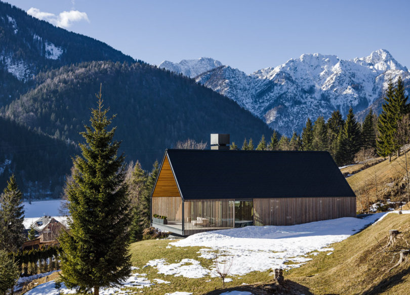 A Holiday Mountain Home Clad with Wood Sunshade in Tarvisio, Italy