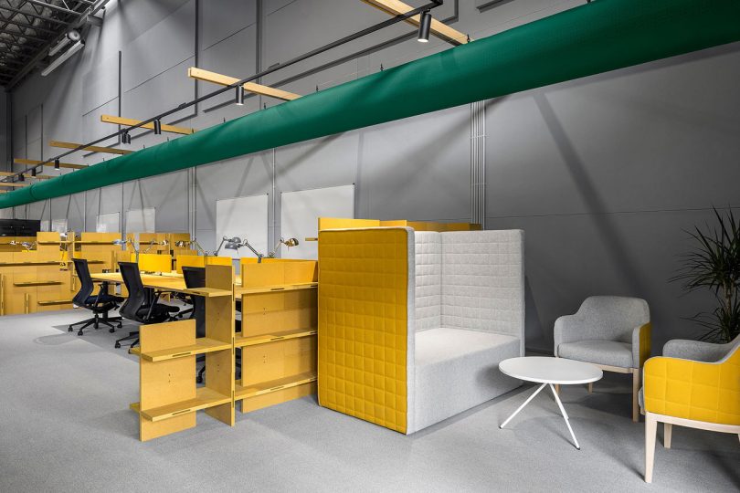 A Warehouse Is Transformed With Shipping Containers Into