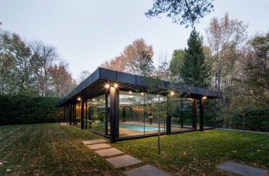 A Glass House Inspired Pavilion Houses an Indoor Swimming Pool