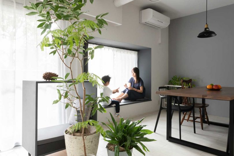 interior shot of modern apartment dining room with two people