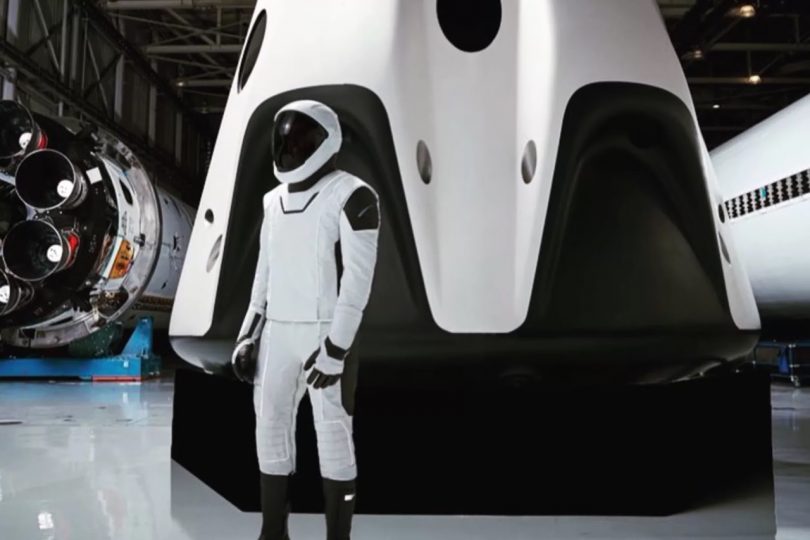 Person in front of spaceship wearing SpaceX Spacesuit Design