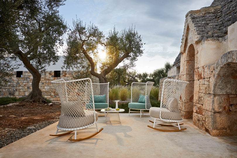 four outdoor rocking chairs