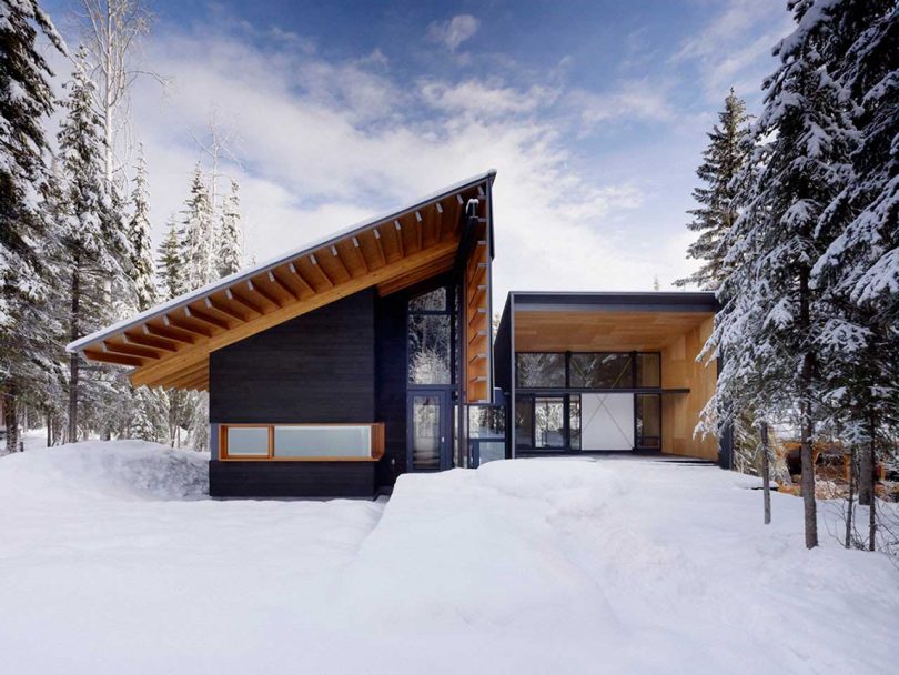 angular modern ski cabin surrounded by snow