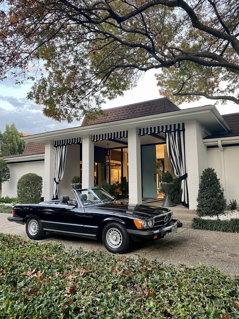 convertible car parked in front of building