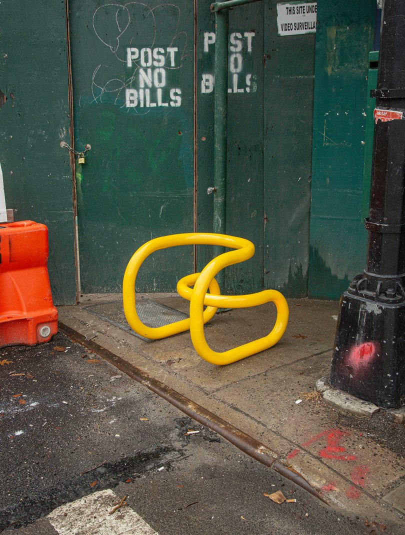 sculptural chair sitting on sidewalk