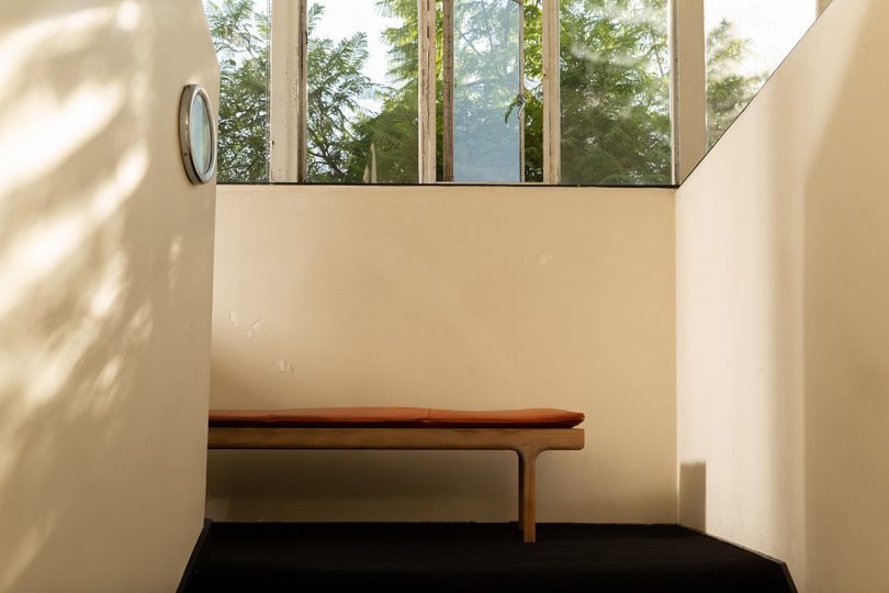 leather topped bench indoors with windows
