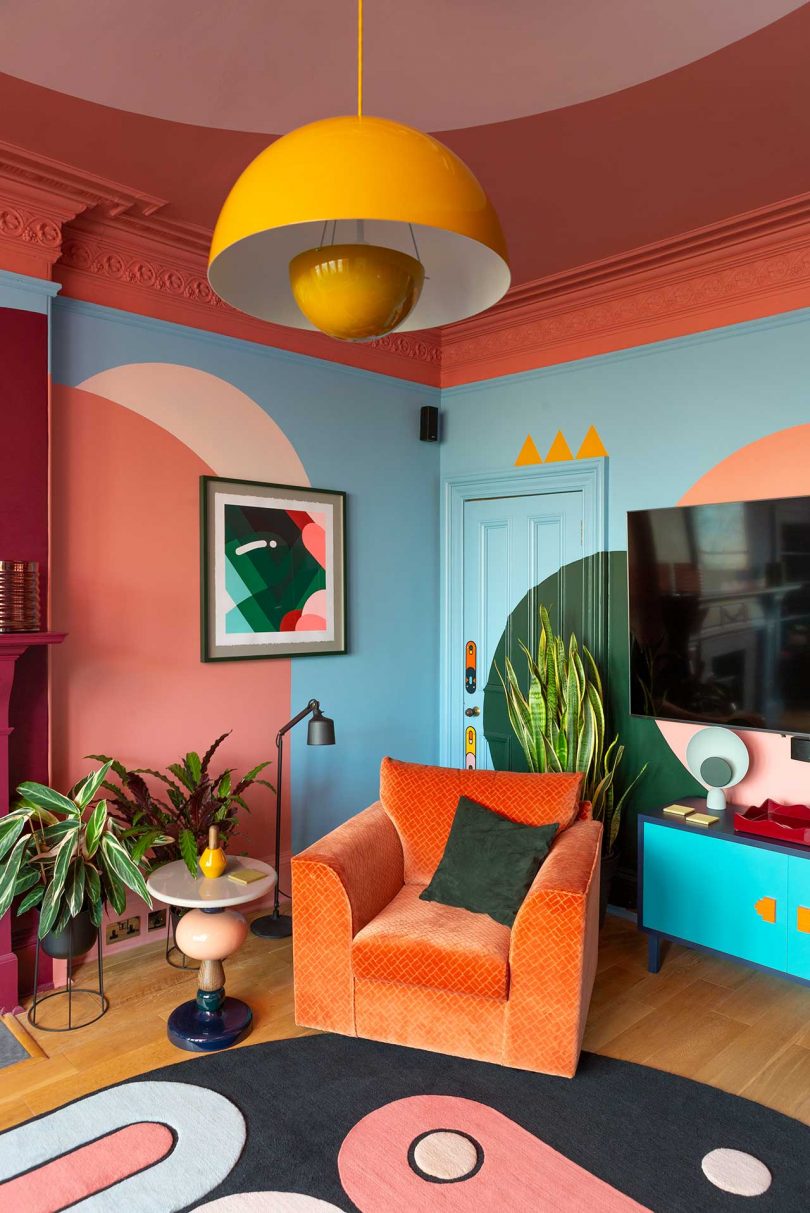 bold colorful living room with graphic paint and patterned rug