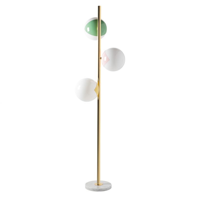three globe floor lamp in gold, green, rose, and yellow