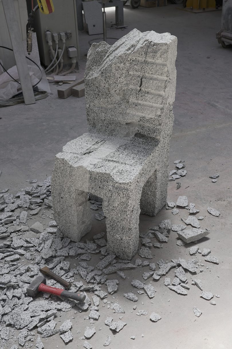 chiseled chair made of grey stone