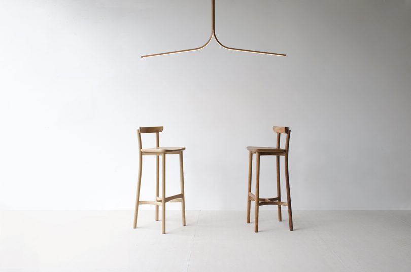 wood pendant light and two wood stools