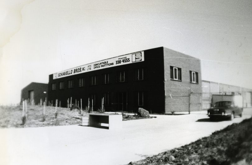 black and white image of a factory building