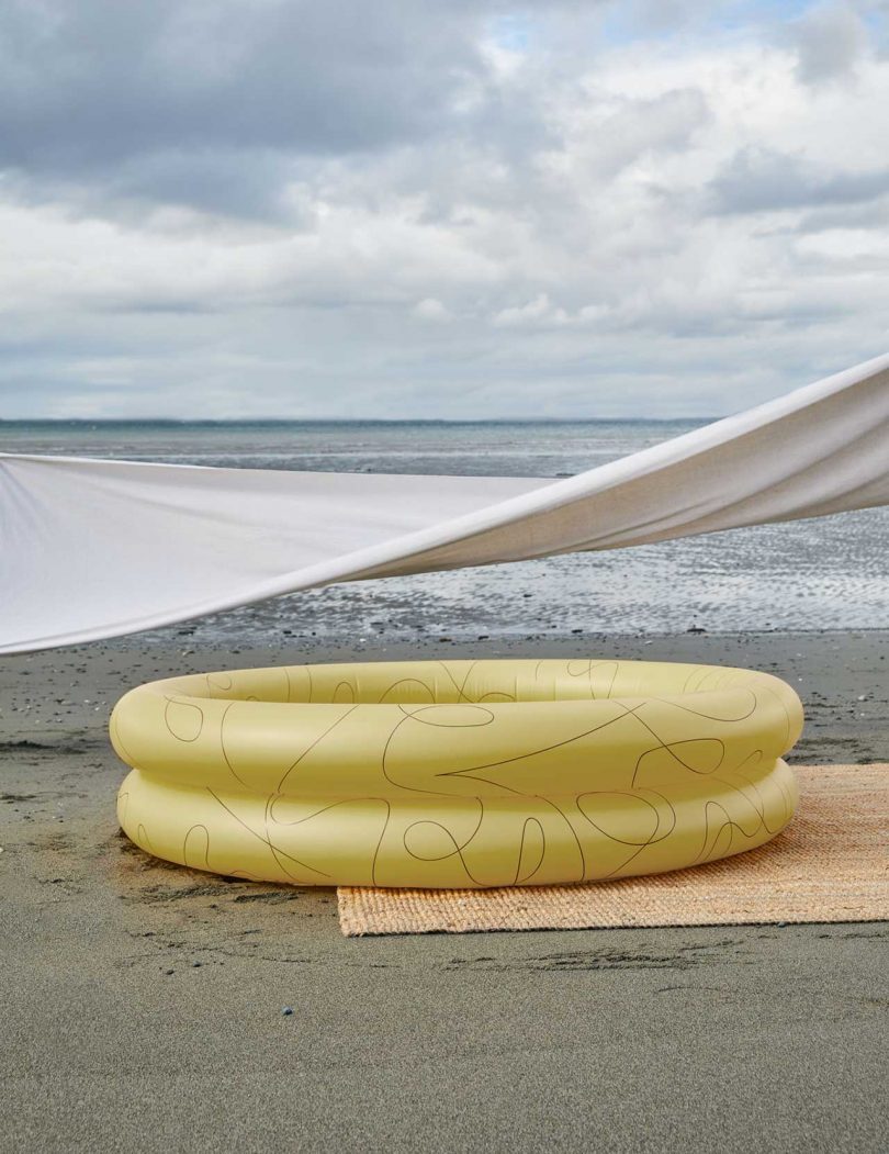 yellow inflatable pool on beach