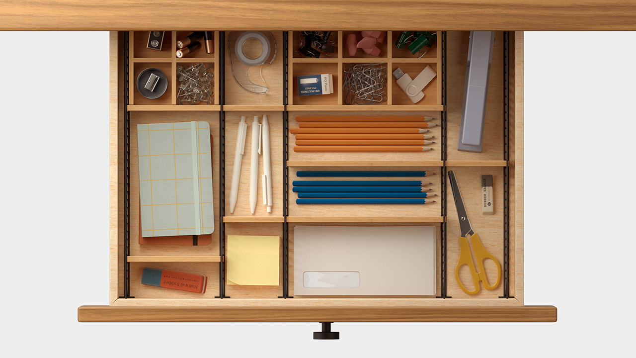 overhead photo of adjustable drawer organizer with desk accessories