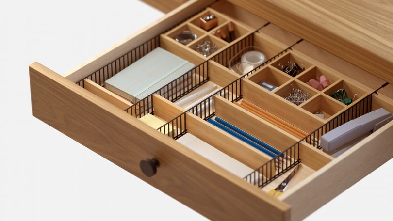 adjustable drawer organizer with desk accessories on white background