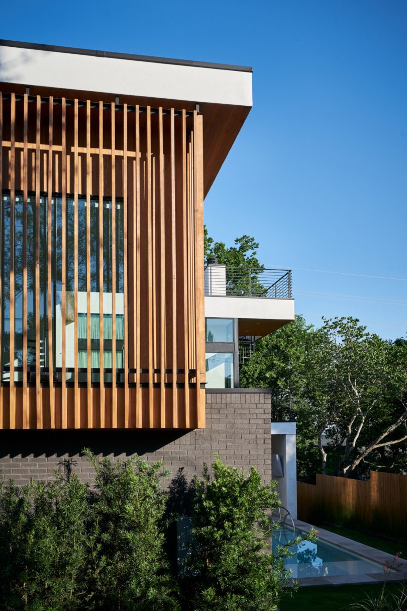 Glass house with wood slats