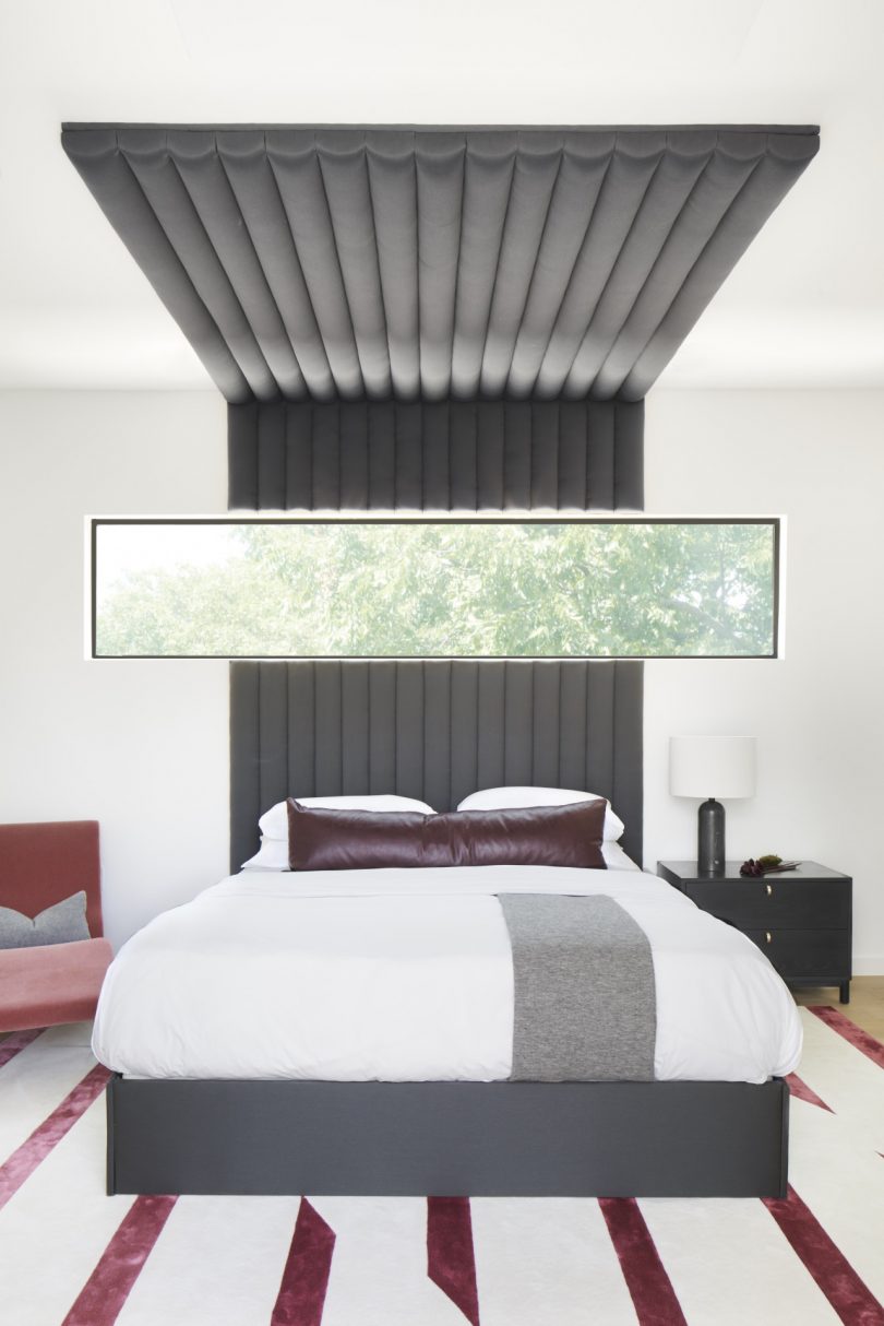 modern bedroom with stripe rug