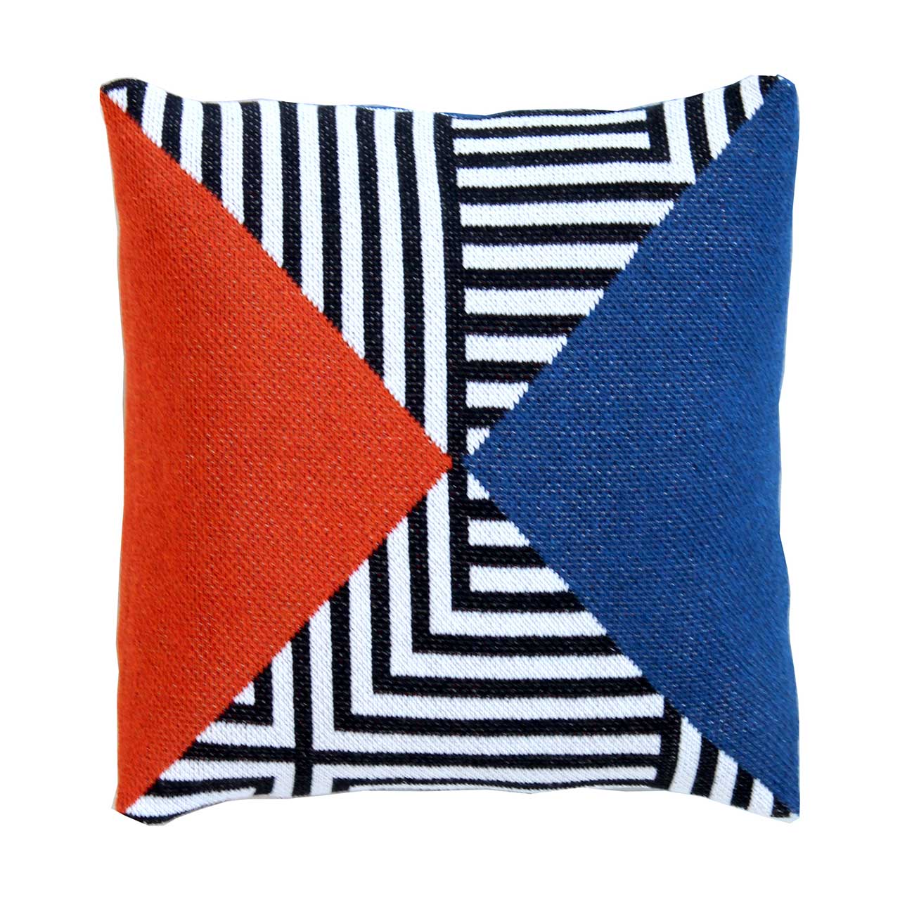 knitted pillow cover with graphic black + white pattern and blocks of red and blue