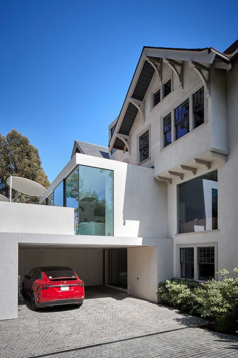 exterior of spanish colonial estate with modern glass addition