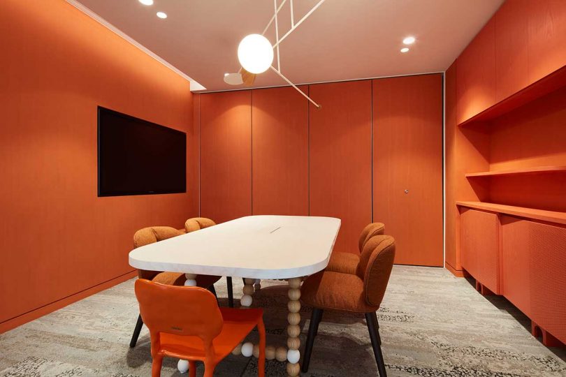 modern office with orange conference room