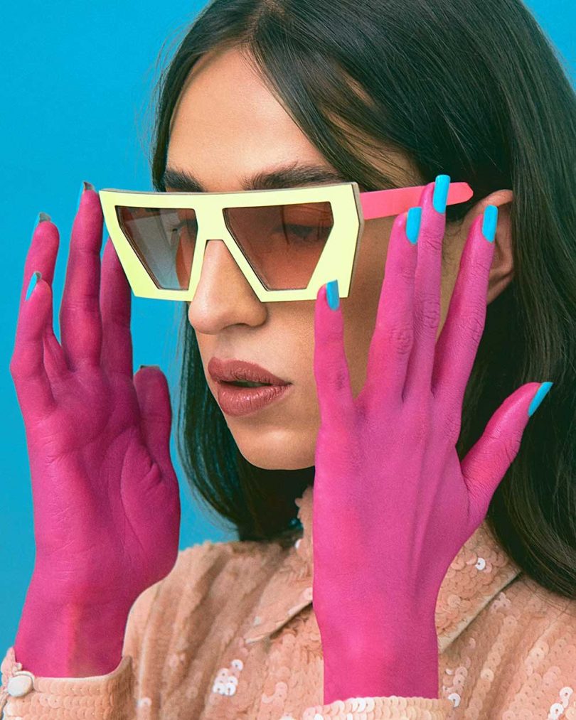 girl wearing yellow and pink sunglasses