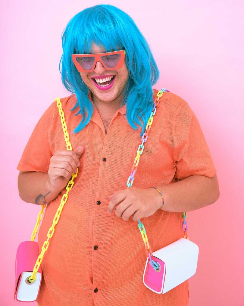 person wearing blue wig and orange sunglasses