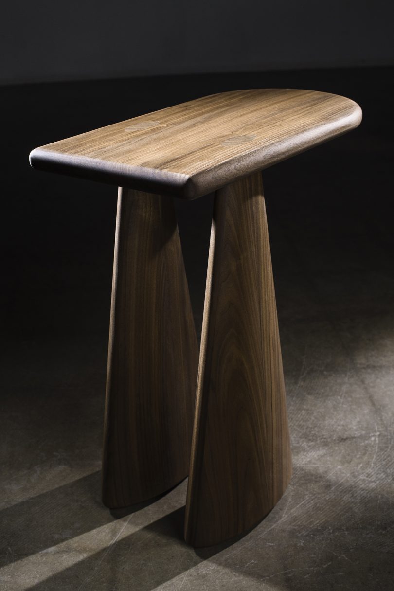 wood side table on cement floor and black background