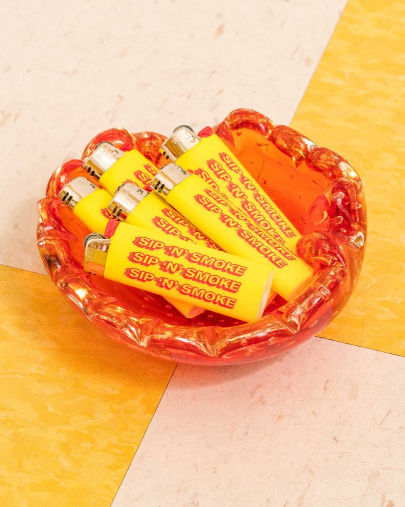 glass dish with yellow and red lighters