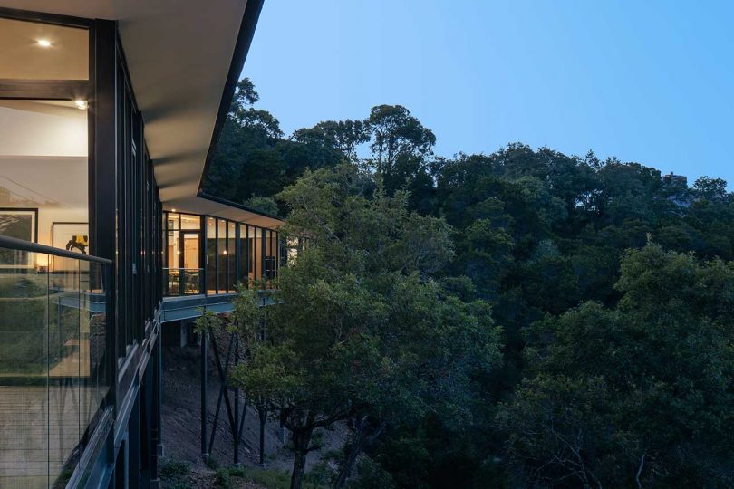 boomerang-shaped house at night