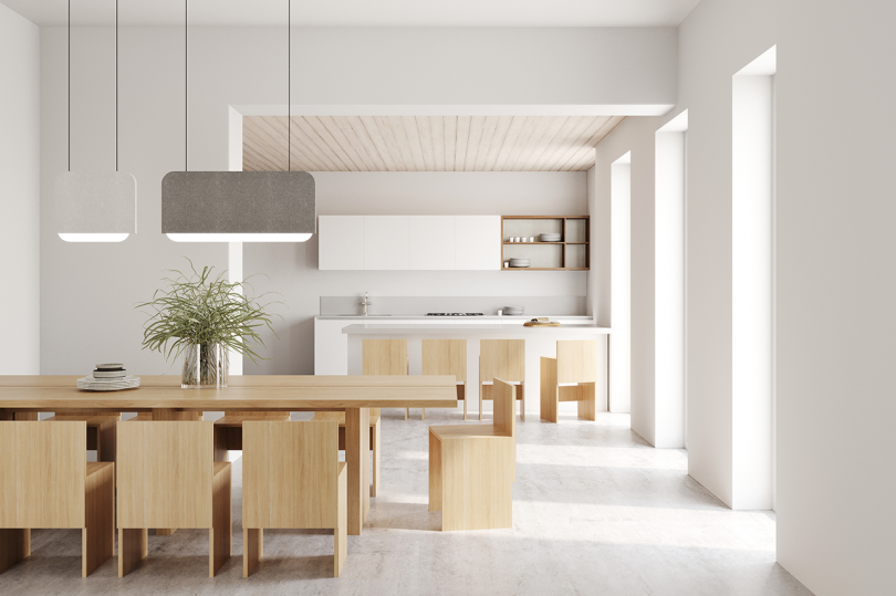 kitchen and dining space with light floors and walls and wood dining set