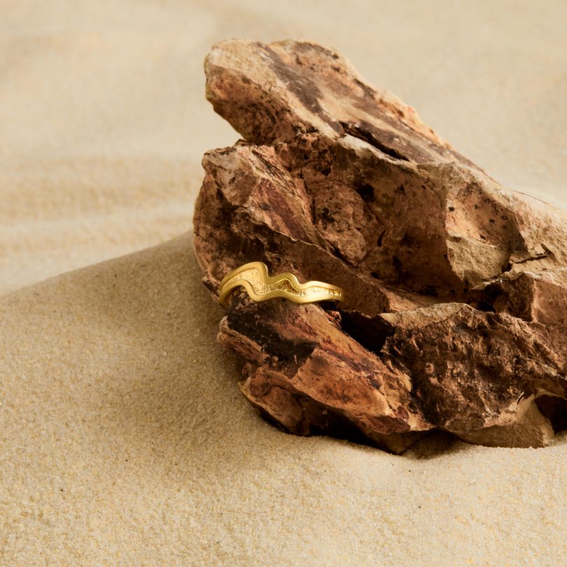 gold plated silver ring on rock