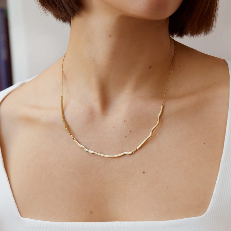 gold plated necklace on model