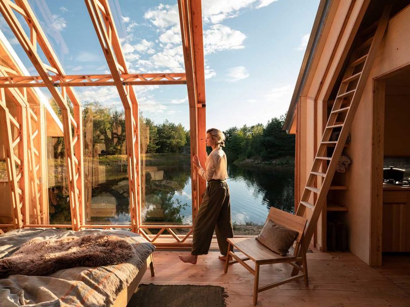 open roof cabin in the woods overlooking water