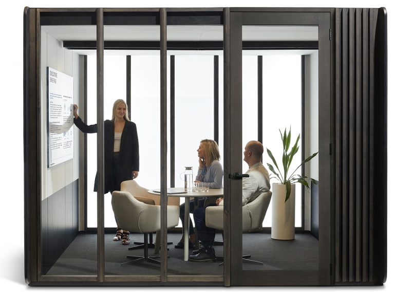 large modular work space with three people inside