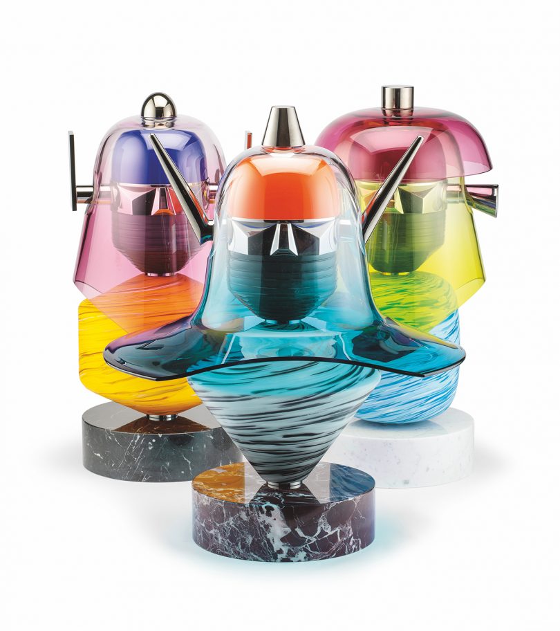 three colorful murano glass sculptures on white background