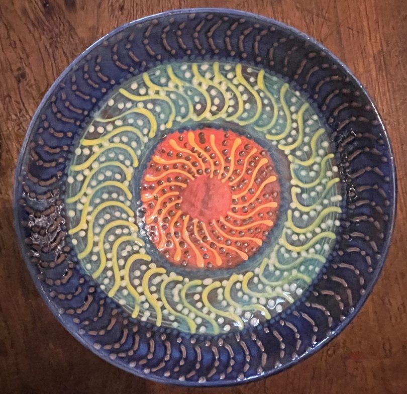 overhead photo of colorful handmade pottery bowl